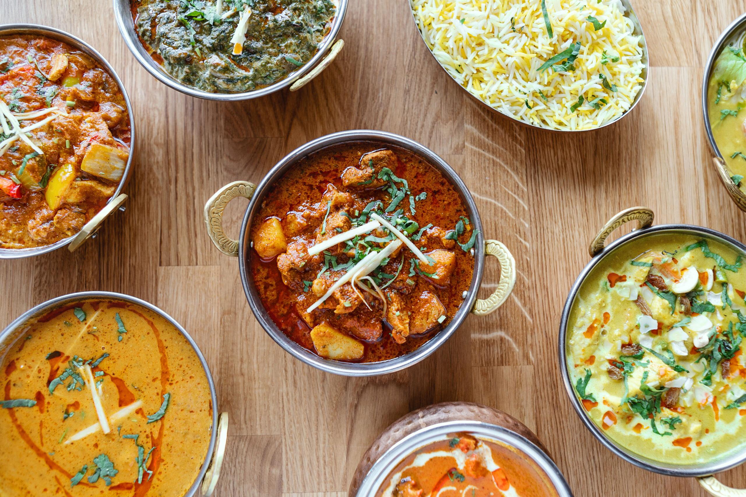 Different indian food on wooden background